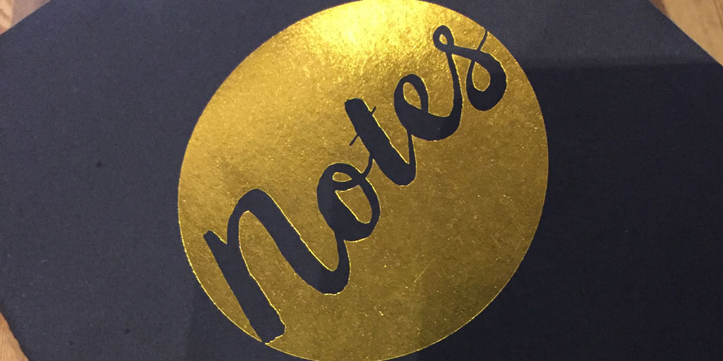 black notebook with gold highlight